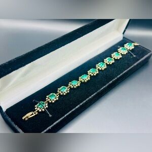 Elegant square green stone bracelet presented in a black velvet box.